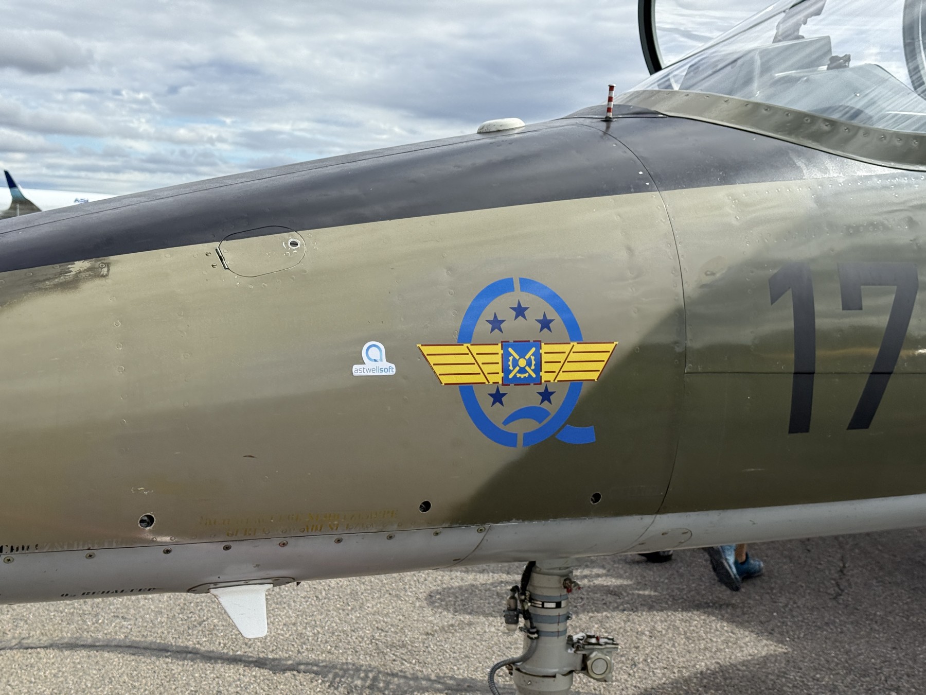L-39 training aircraft on the flight line with AstwellSoft branding on the fuselage